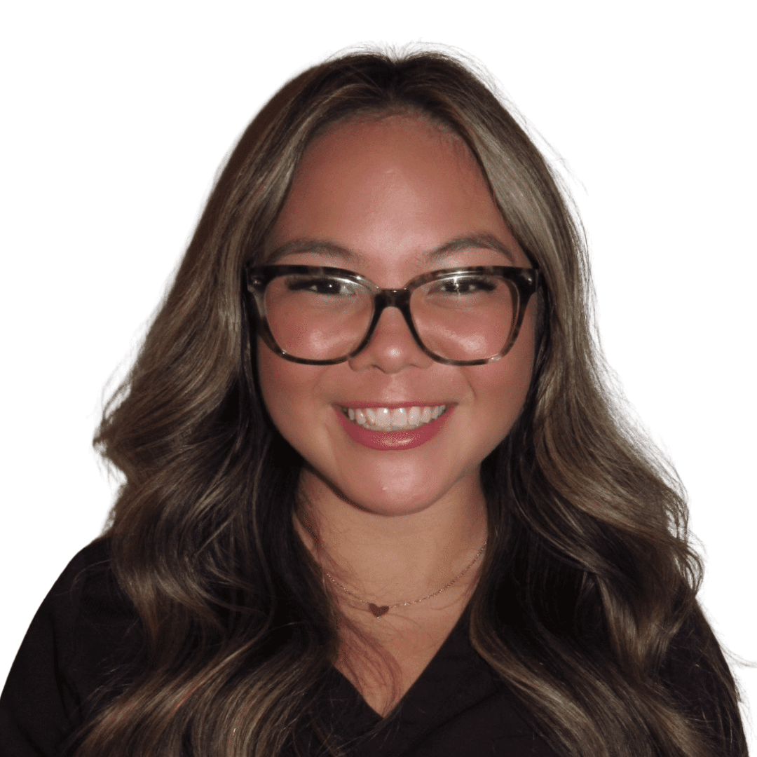 a woman wearing glasses and smiling at the camera