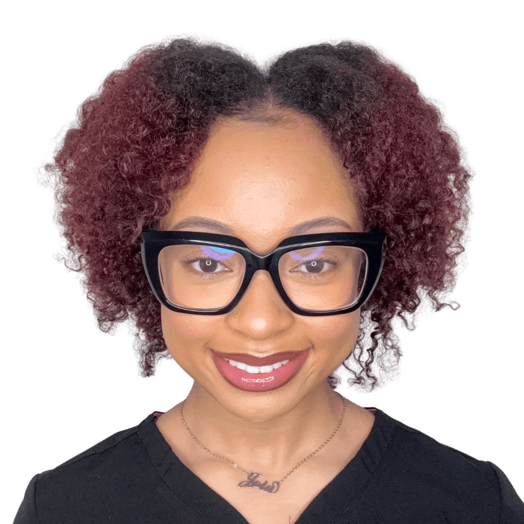 a person wearing glasses and looking at the camera